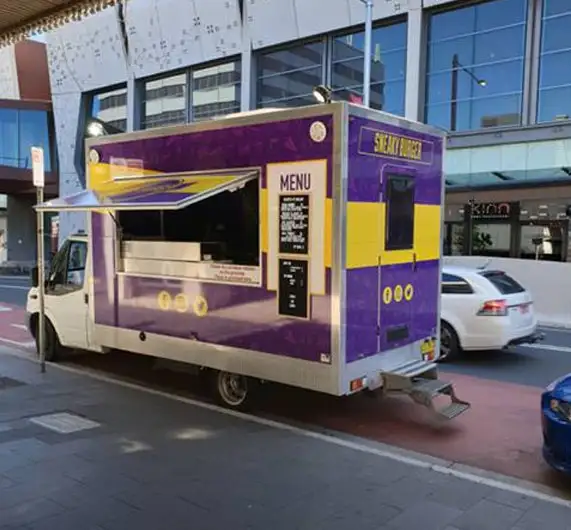The Sneaky Burger food truck parked at a local event